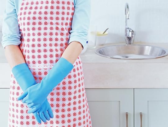 Woman by the kitchen sink --- Image by © Royalty-Free/Corbis