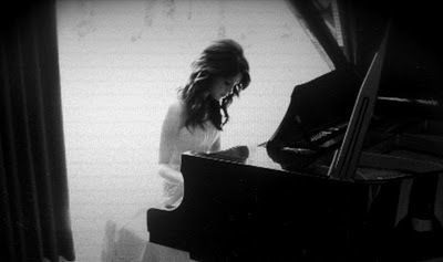 woman playing piano