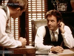 Robert Duvall as Tom Hagen and James Caan as Sonny in 