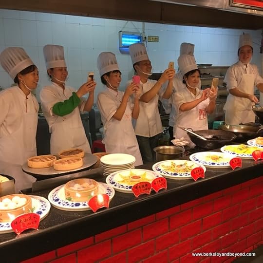 line of chefs taking photos at Tian Yi Jiao Restaurant in Wenzhou, China