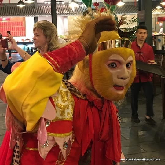 everyone wants a photo of the Monkey King at Tian Yi Jiao Restaurant in Wenzhou, China