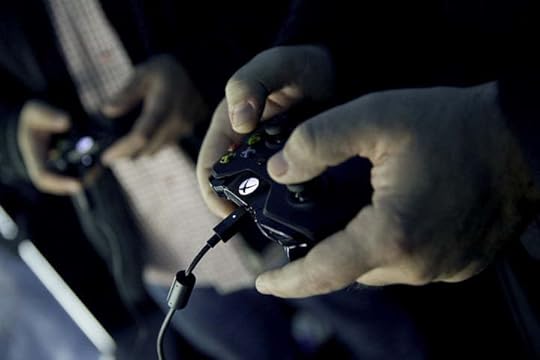 People playing video games with Xbox One controller Mike Ybarra