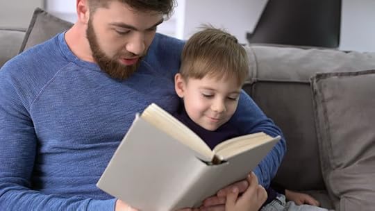 Image result for boy and father reading, looking serious