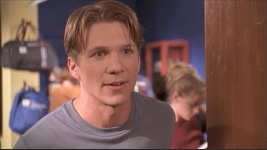Generically handsome white guy with a stupid center-part haircut.