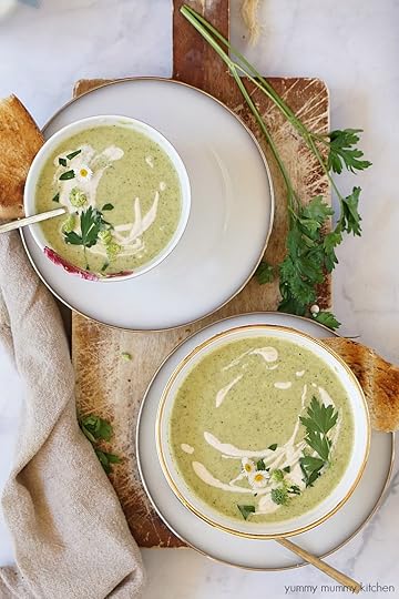 Beautiful bowls of creamy vegan broccoli soup topped with cashew cream.