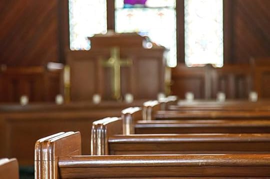 Church Pews with Stained Glass Beyond Pulpit