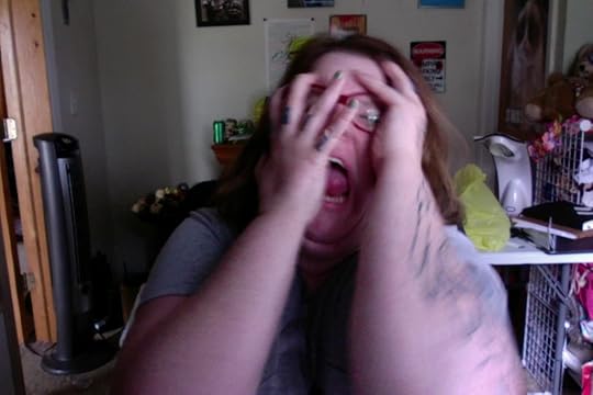 a blurry photo of me clawing my face off.