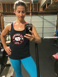 Boot camp instructor Rachel Flanagan takes a selfie in her Garage Gym Life tanktop