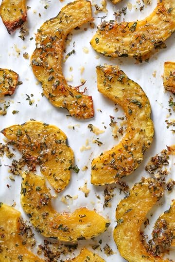  Roasted Delicata squash topped with a Parmesan-herb crust, I like to leave it in the oven until the edges are crisp, golden and delicious! Acorn squash can be used in place of Delicata.