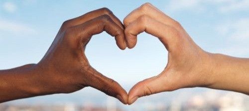 interracial gay couple heart hands
