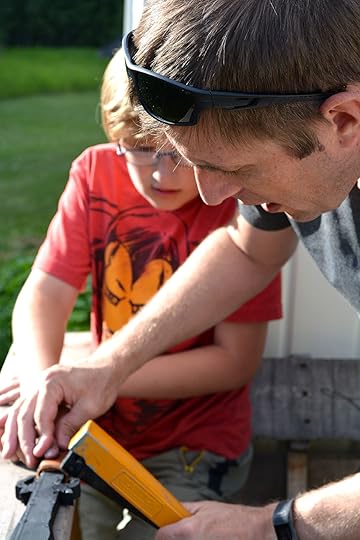 Father-son craft time: Jason helped the boys (and a few other kids, too) make their own wooden swords this summer, complete with leather-wrapped handles.