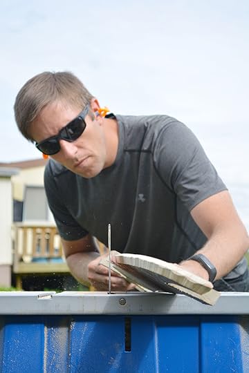 Concentrating on cutting the blade on a kid-designed sword.
