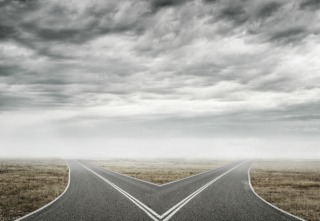 Natural landscape image of forked asphalt road