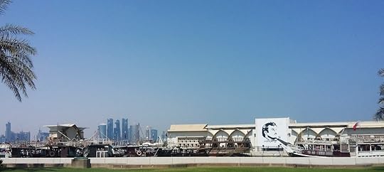 Dhows with modern cityscape and image of the Emir, in Doha