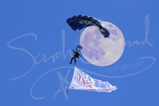 Parachute against the moon