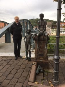 woman next to war memorial