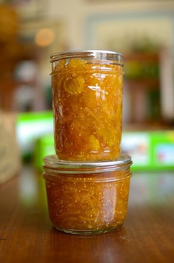 Two stacked jars of fig meyer lemon marmalade