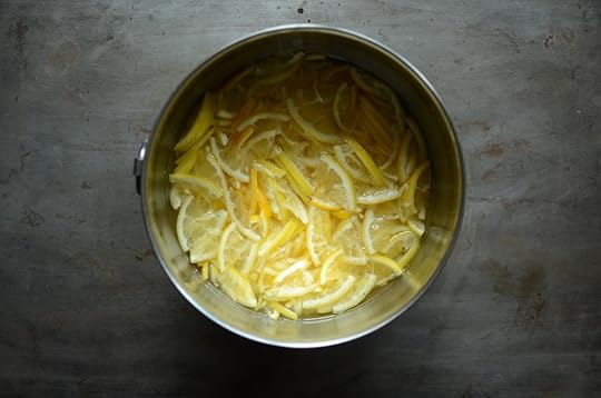 Sliced meyer lemons soaking in a bowl of water for fig meyer lemon marmalade