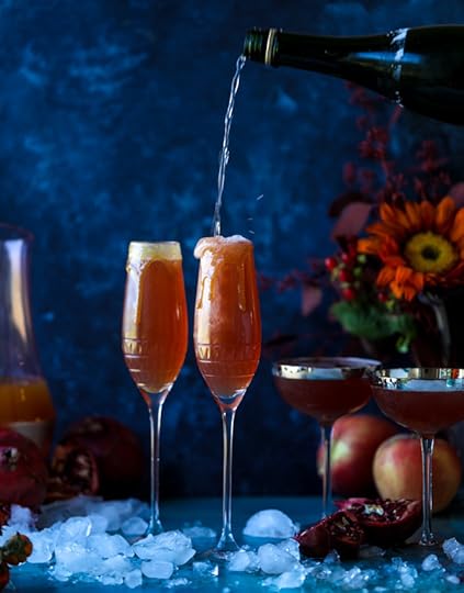 pomegranate cider mimosas with a salted caramel rim I howsweeteats.com #cocktails #thanksgiving #applecider #mimosas