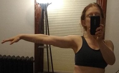 arm extended to show musculature