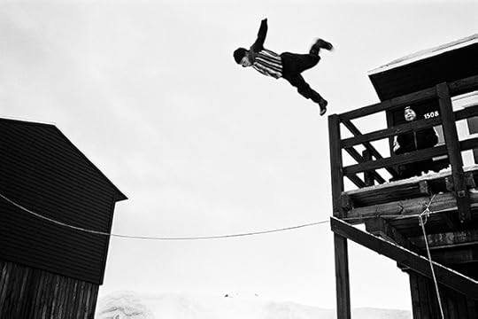 Jacob Aue Sobol, A boy does a somersault and lands in a deep pile of snow, Tiilerilaaq, Greenland, 2001 ©the artist/Magnum Photos