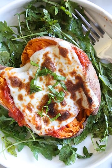 These savory stuffed sweet potatoes are topped with Italian flavors such as marinara sauce and cheese. A quick and easy healthy vegetarian dish.