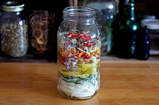 Ingredients layered in the jar for homemade fire cider