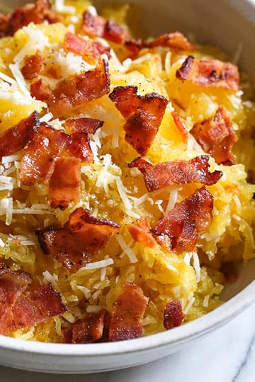 Roasted spaghetti squash with bacon and Parmesan cheese is a great way to top spaghetti squash for an easy, tasty, low-carb side dish. Although there are several methods to cook spaghetti squash, my favorite way to make it is roasted. To roast the squash, I cut it on half lengthwise, remove the seeds and cook it cut down for about one hour.