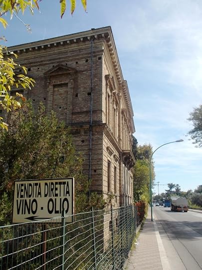 On the Adriatic Coast - bricked up building with sign advertising wine and oil