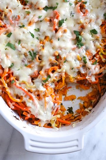 Spiralized Winter Veggie Gratin is the perfect holiday side dish! Made with spiralized vegetable gratin is made with sweet potatoes, butternut squash, carrots, and parsnips and topped with a white sauce and Gruyere cheese.