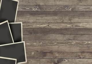 Photo frame on wooden background for design or montage