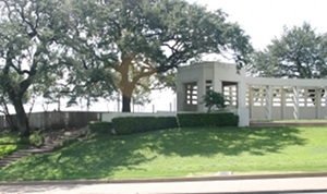 Dealey Plaza Pergola sits atop a sloping hill known as the Grassy Knoll