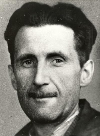 A photo showing the head and shoulders of a middle-aged man with black hair and a slim moustache.