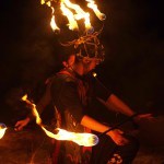 fire dancer kneeling