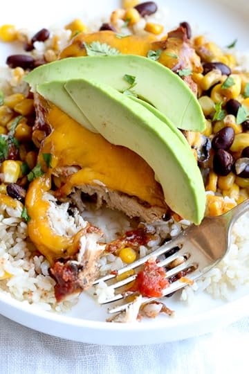 This EASY Slow Cooker Chicken dish is cheesy and delicious, made with boneless chicken breast, black beans, corn and salsa topped with melted cheddar cheese. YUM!