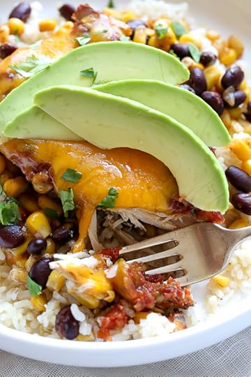This EASY Slow Cooker Chicken dish is cheesy and delicious, made with boneless chicken breast, black beans, corn and salsa topped with melted cheddar cheese. YUM!
