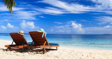 Two chairs on the tropical beach