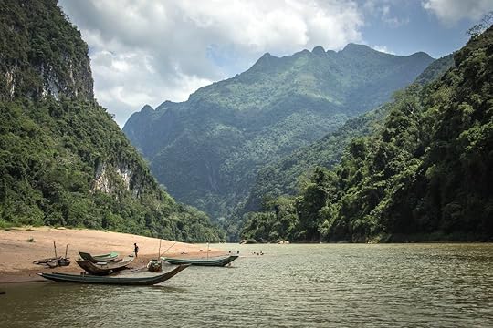 Beach in Laos with canoes