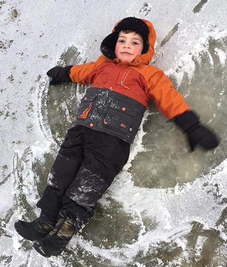 B. learns the art of snow angels!