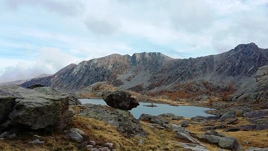 Perched rock beside small lake in the Valley