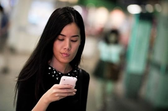 Woman staring at smartphone