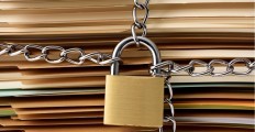closeup-of-stacked-brown-file-folder-with-locked-padlock-picture-id598953630