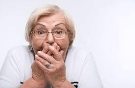 Hands over mouth surprise