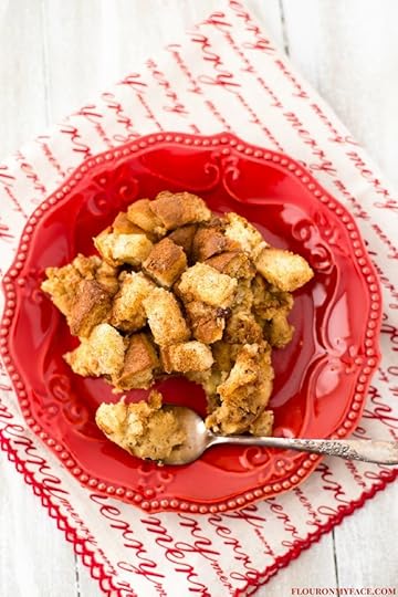 Crock Pot Eggnog Bread Pudding recipe served on a festive red deesert plate with a Christmas napkin