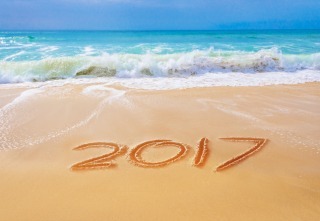 2017 written on the sand of a beach, travel 2017 new year concept
