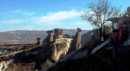Ürgüp: small fairy chimneys under small rocks, Cappadocia