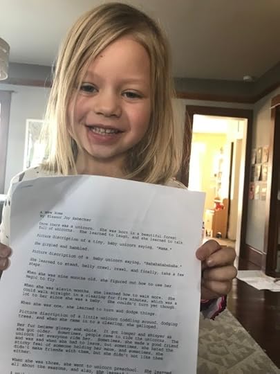 Poppy holding the story Eleanor wrote.