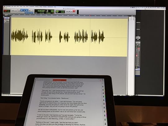 computer with recording software on screen and iPad with text on screen