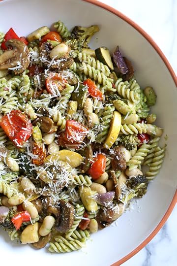 One bite of this Balsamic Roasted Veggie and White Bean Pasta and you'll want to make it all summer long! Roasted zucchini, yellow squash, mushrooms, peppers, and broccoli – loaded with veggies in every bite and finished with pesto and white beans. This is SO good, and picky husband approved!
