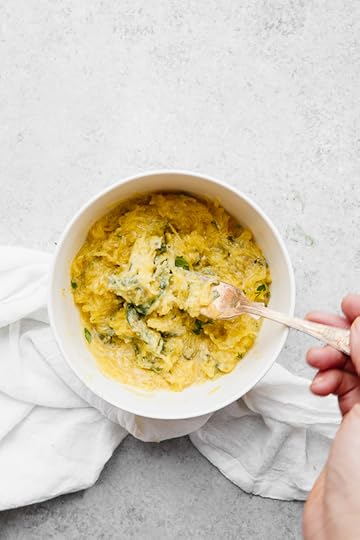 This easy, cheesy baked spaghetti squash is a healthier take on mac and cheese! It's cheesy, loaded with vegetables and feels like comfort food, without the calories and carbs.
